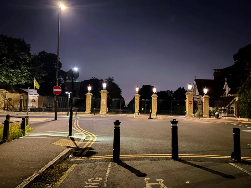 The gates of the Greenwich Royal Observatory at night marking the end of The Giant Circle